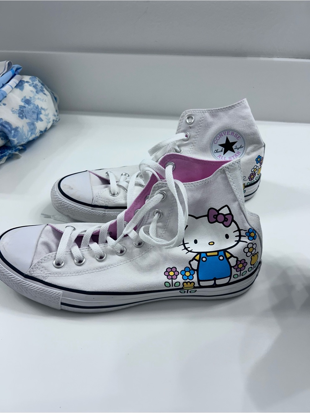 Converse Women’s White Hello Kitty High-Top Sneakers with Pink Lining